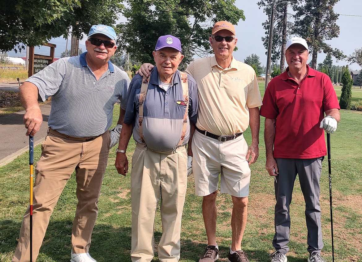 Players pose for a photo at the Don Leen Memorial Golf Tournament. Left to right: Matt Haflam, Dan Hull (tournament organizer), Tom Kline, and Mike Thompson.