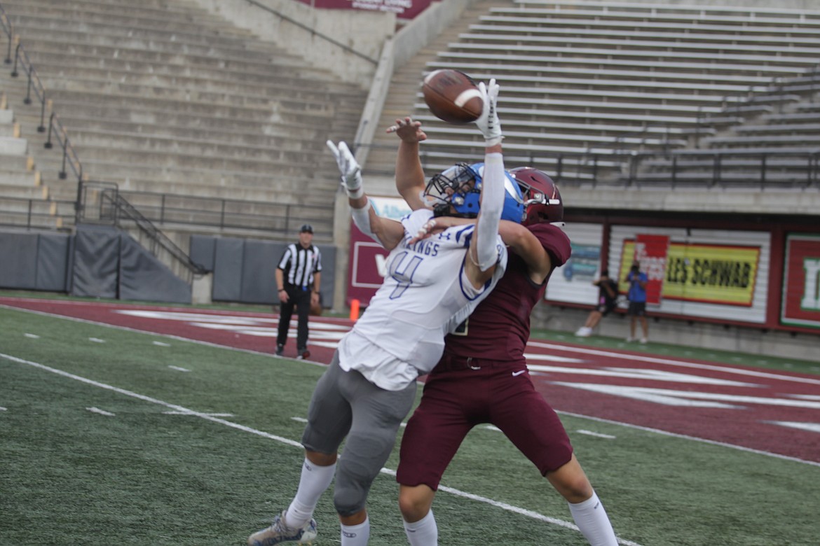 JASON ELLIOTT/Press
Coeur d'Alene senior wide receiver Keaton Cameron attempts to bring in a catch during the first quarter of Friday's game at Washington-Grizzly Stadium in Missoula.