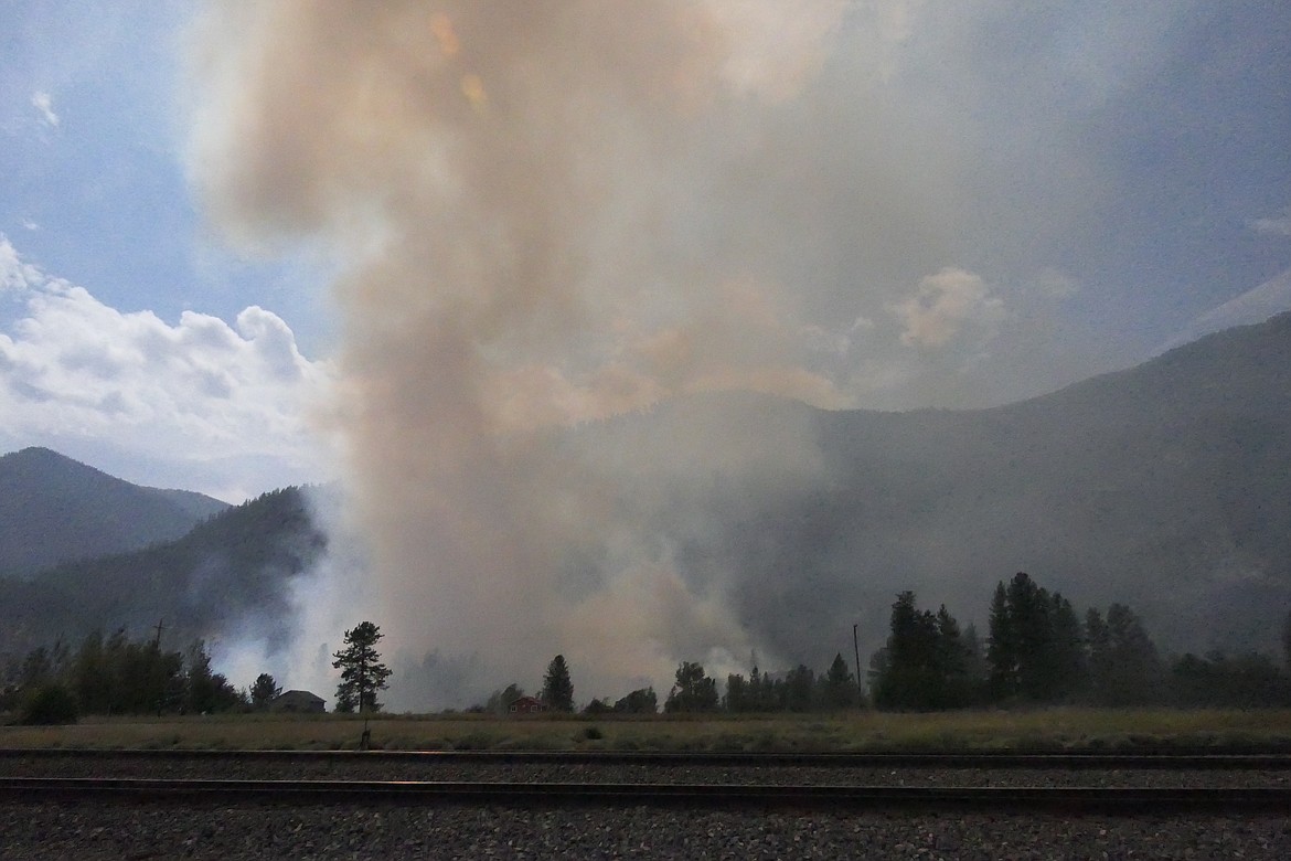 A column smoke rises from the site of a train-sparked fire near the town of Paradise on Friday, Aug. 18, 2023. (Chuck Bandel/Valley Press)