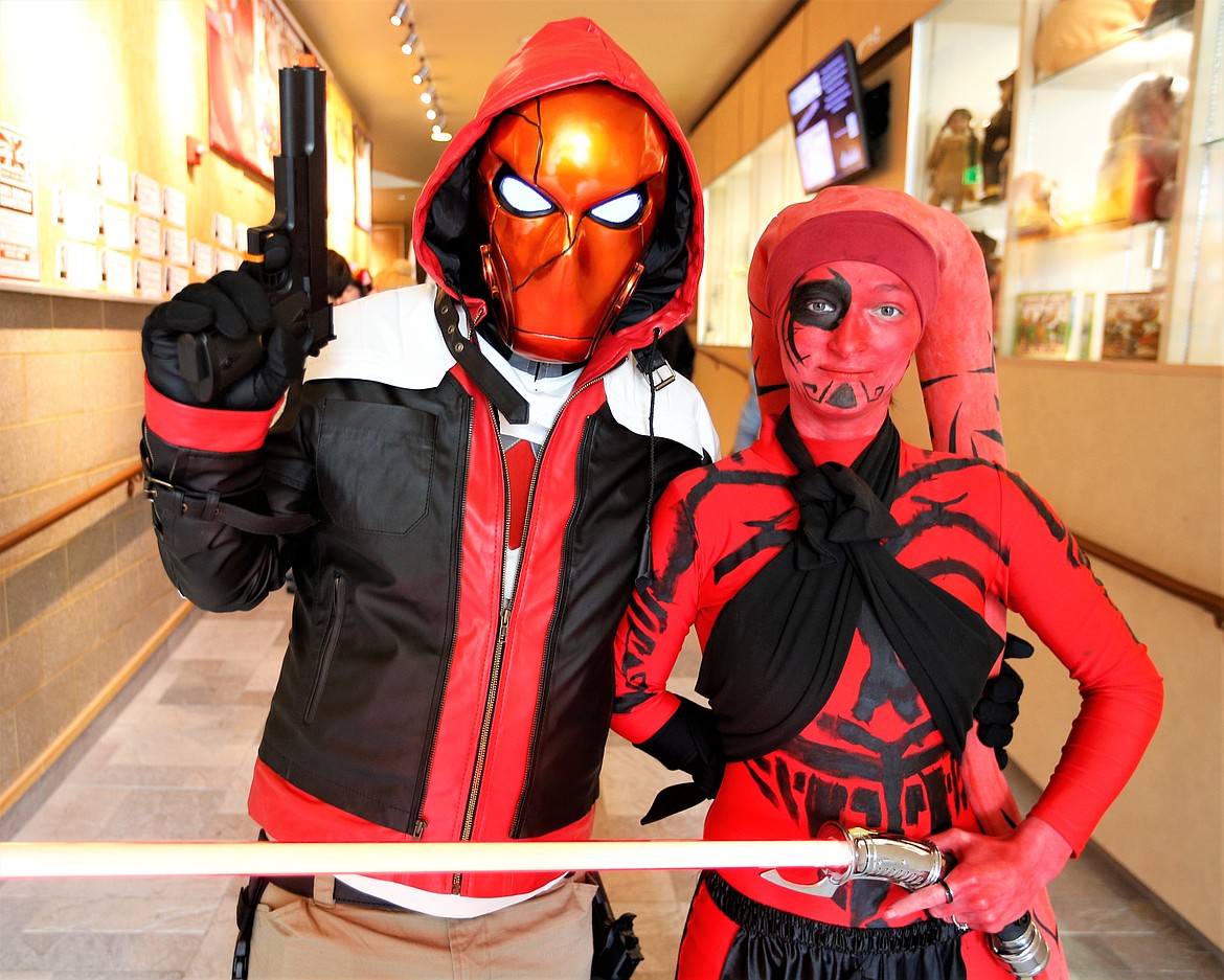 Eric Ulbredtch as Red Hood and Kyla Eisler as Darth Talon attend Coeur d'Con at the Coeur d'Alene Public Library on Saturday.