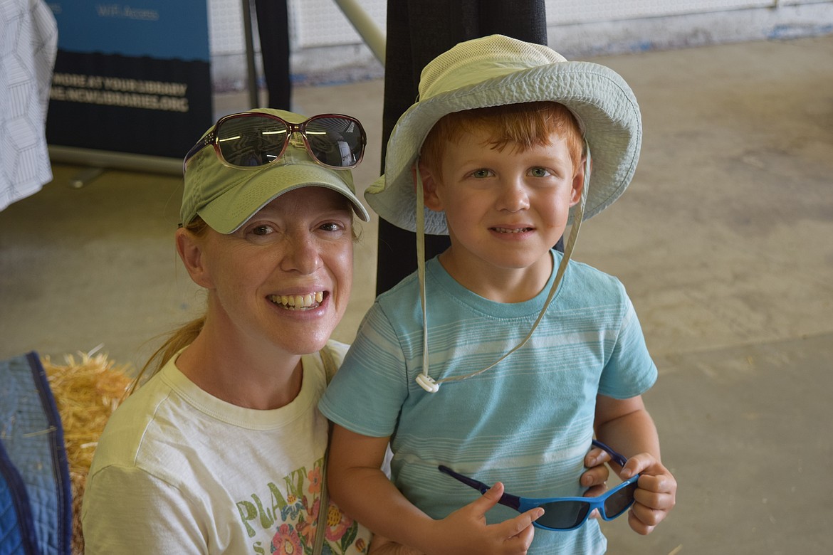 Jen Scott and her son, Luke Scott, inside the Youth Building at the Grant County Fair after the NCW Library storytime.