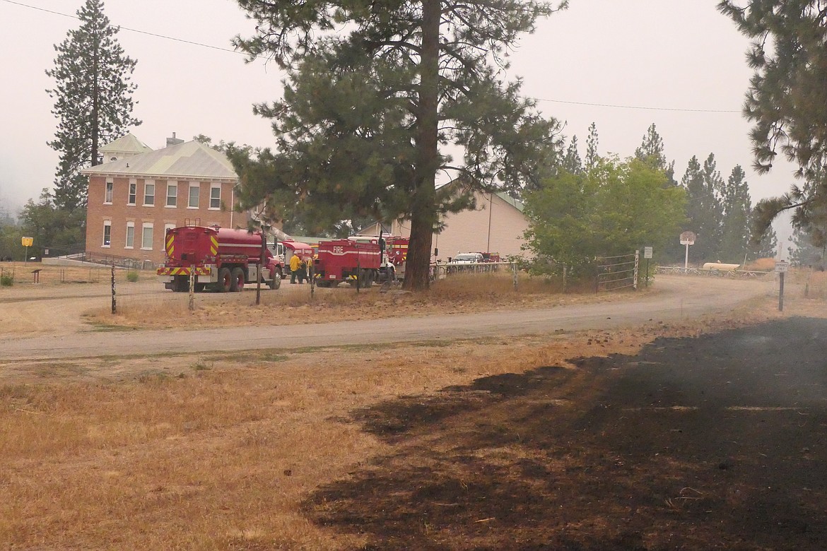 Firefights outside the Paradise Community Center on Saturday morning. (Chuck Bandel/VP-MI)