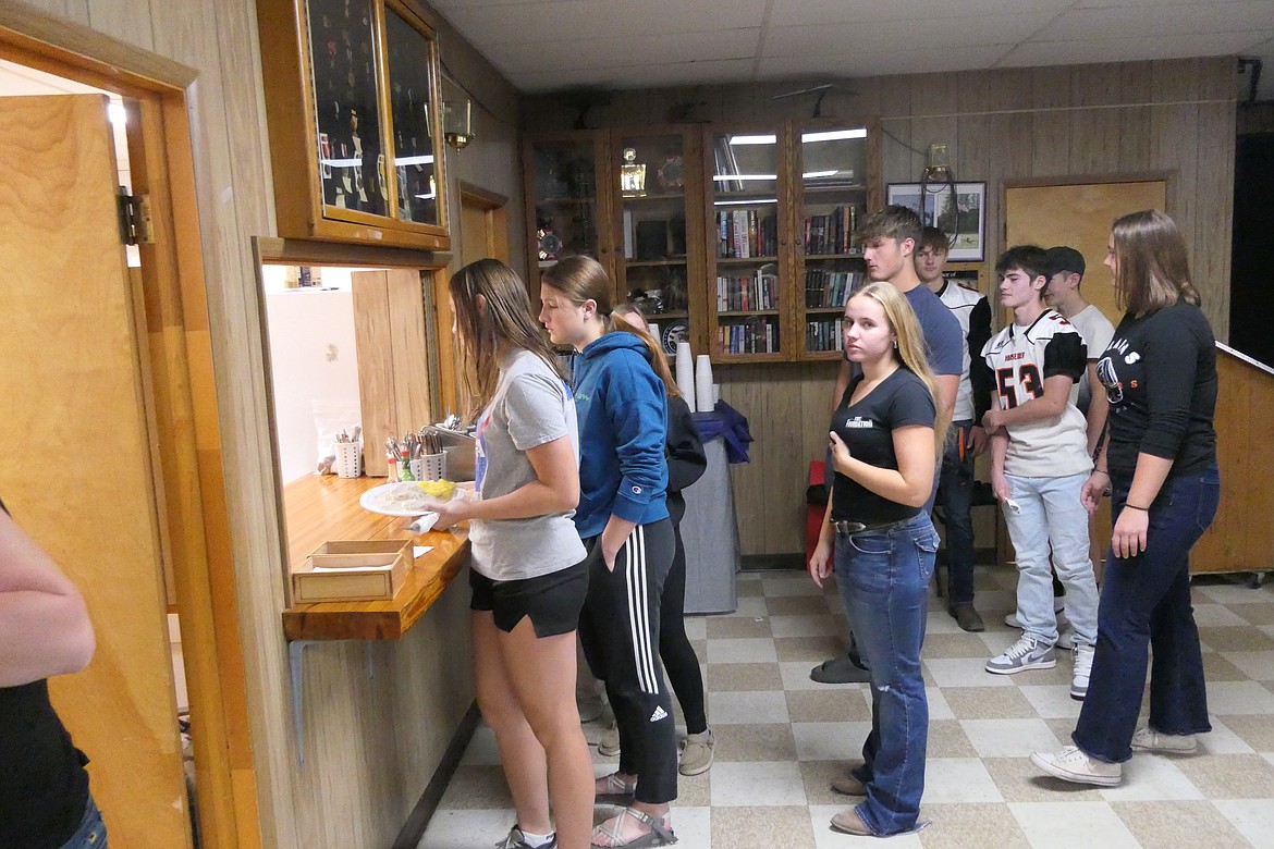 Members of the Plains High volleyball and football teams volunteered to serve breakfast to the more than 100 firefighters who attended the event at the Wildhorse VFW in Plains early Sunday morning. (Chuck Bandel/VP-MI)