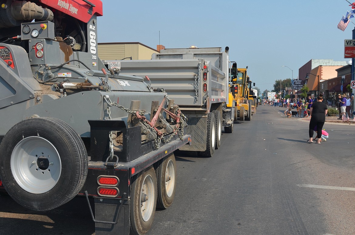 A brigade of county road equipment rumbled down Main Street during Saturday's Centennial Parade. (Kristi Niemeyer/Leader)