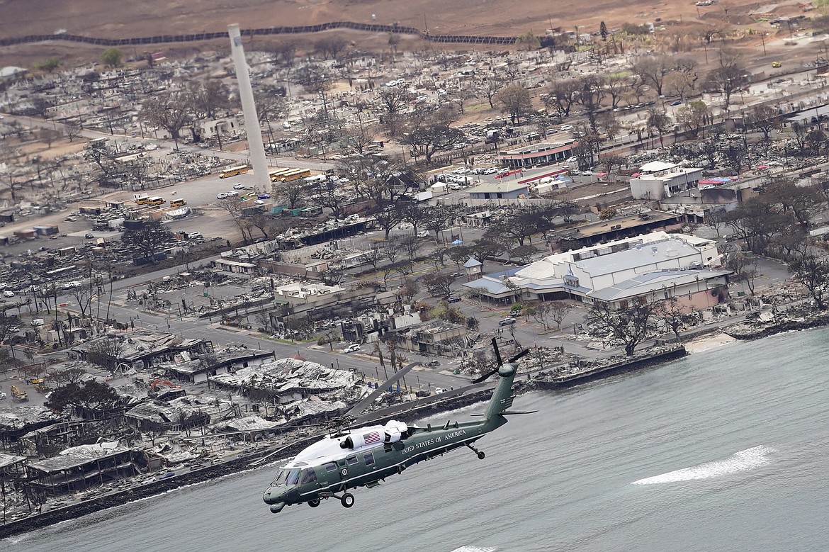 President Joe Biden and first lady Jill Biden take an aerial tour on Marine One over areas devastated by the Maui wildfires, Monday, Aug. 21, 2023, in Lahaina, Hawaii. (AP Photo/Evan Vucci)