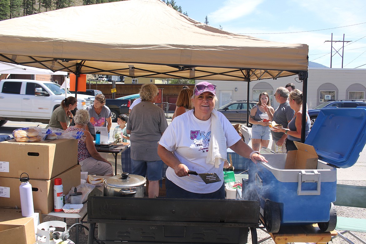 Chief Lifeguard for the Pool in the Park committee, Cheryl Crabb, spent the day flippin’ burgers and hotdogs as this devoted group continues to raise awareness and money to have a new pool built in Eva Horning Park. (Monte Turner/Mineral Independent)