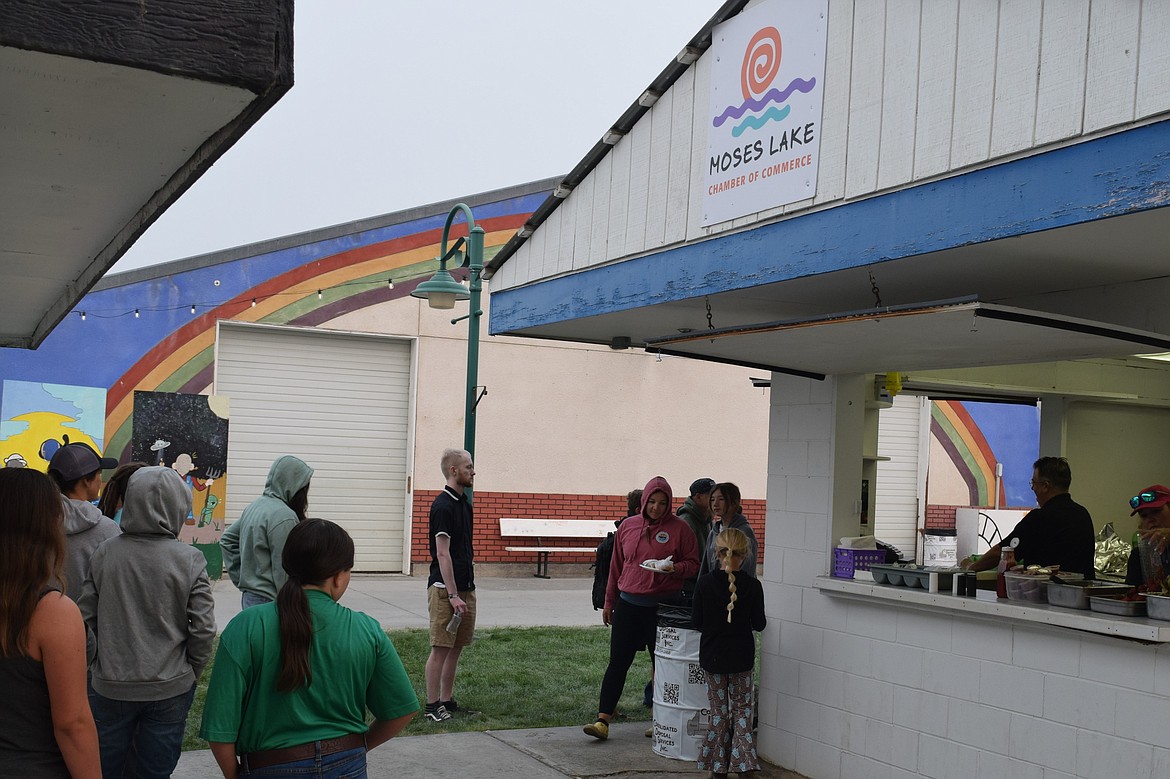 A line forms for breakfast Sunday morning at the Moses Lake Chamber of Commerce vendor booth at the Grant County Fairgrounds. The Chamber and local sponsors provided food to help make preparing to take livestock home from the fair easier for children and families.