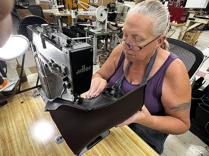Debbie North sews leather boot uppers. North has been sewing for Hoffman Boots for more than a decade.