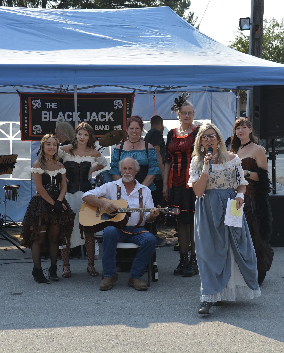 Emily Denney kicks off the celebration of the Molly Queens by introducing Dave Miller to sing a song about the "patron lady" of Murray, Molly B'Damn.