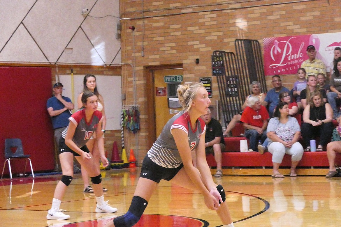 Senior middle hitter Lauryn Aldridge waits to receive a serve from a Noxon player last year while Kara Christensen (10) looks on.  (Chuck Bandel/VP-MI)