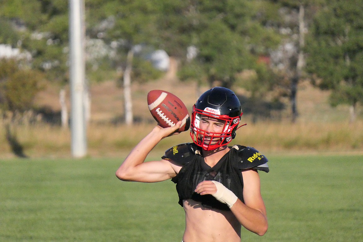 Junior quarterback Nick McAllister warms up his throwing arm during pre-season practice last week in Hot Springs. (Chuck Bandel/VP-MI)