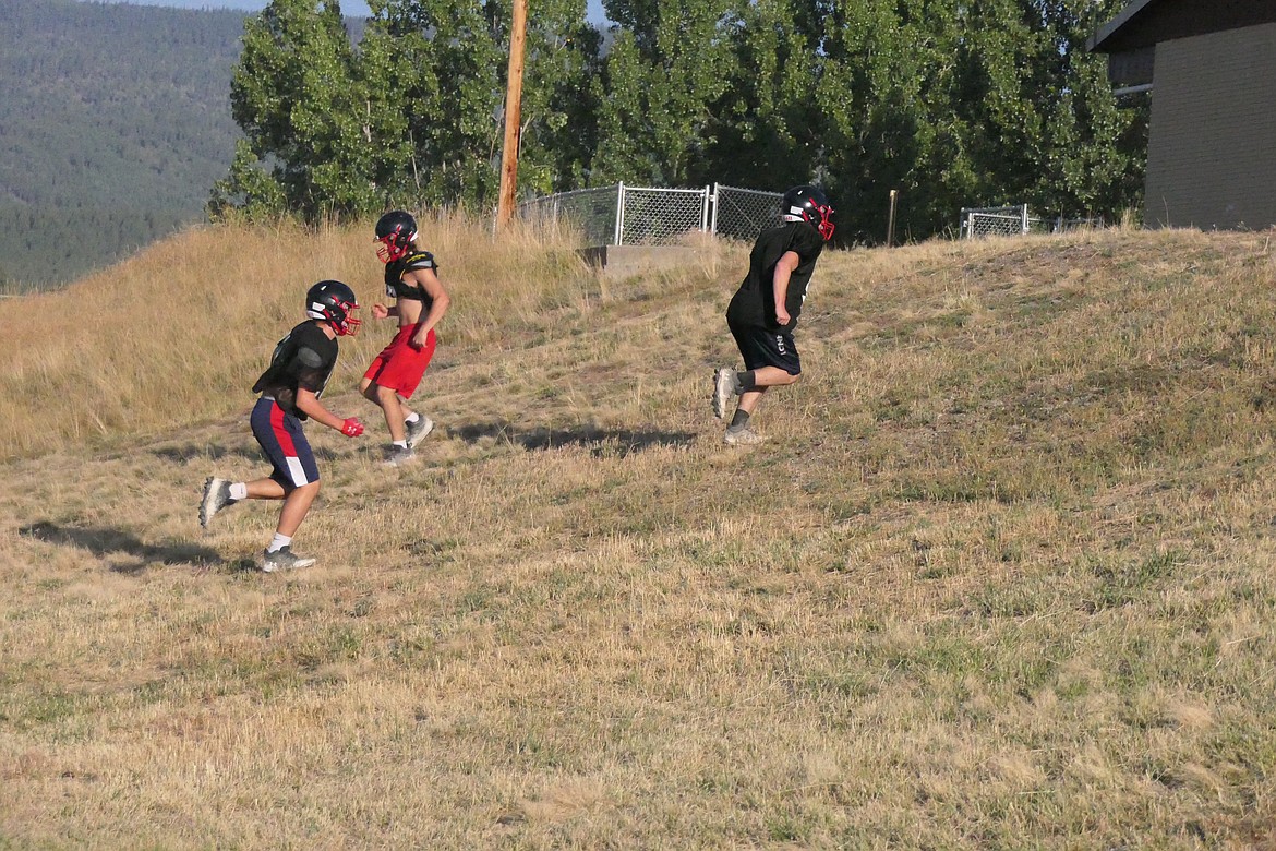 Savage Heat players run "the hill" during a recent preseason practice in Hot Springs.  The Savage Heat travel to West Yellowstone for their season opener this Saturday. (Chuck Bandel/VP-MI)