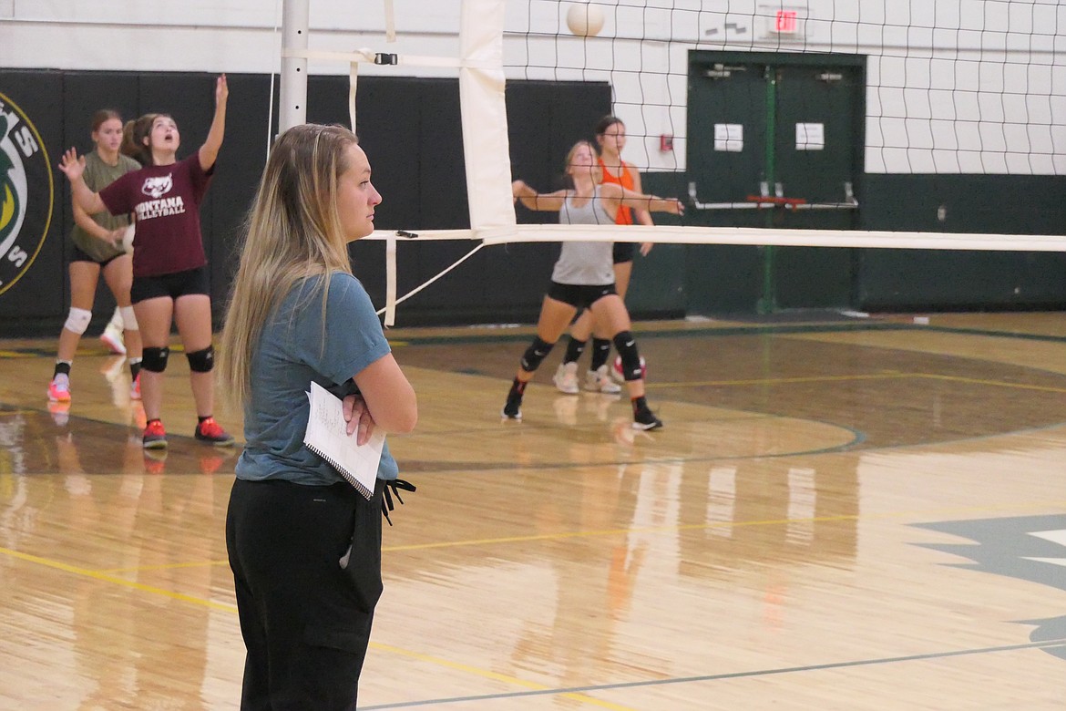 St. Regis head volleyball coach Kianna Barnett watches her Lady Tigers team go through some pre-season drills last week in St. Regis. (Chuck Bandel/MI-VP)