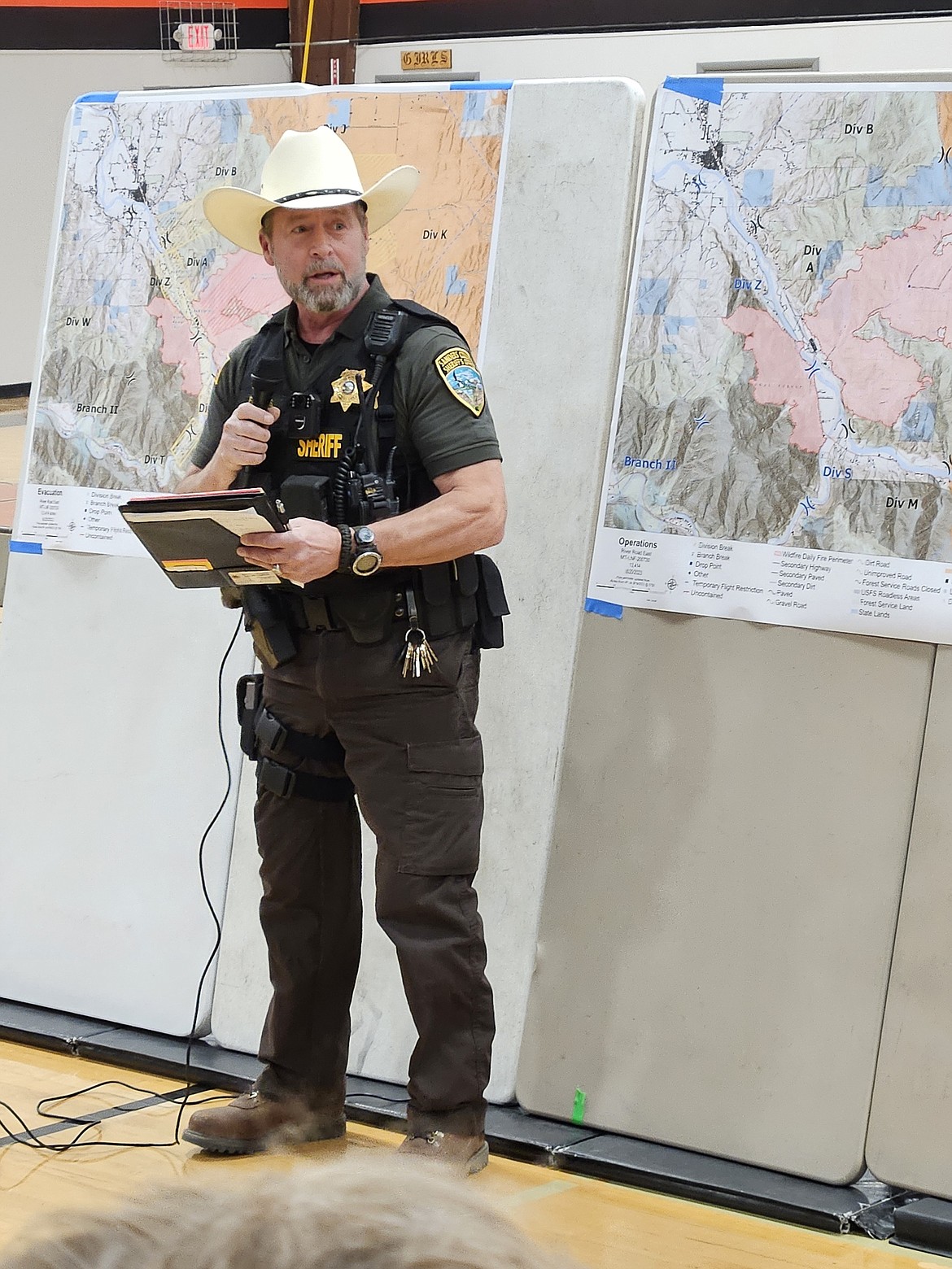 Sanders County Sheriff Shawn Fielders addresses the crowd of approximately 150 area residents who attended an informational meeting in Plains about the Paradise fire and what is being done to combat it. (Lisa Larsen/Valley Press)