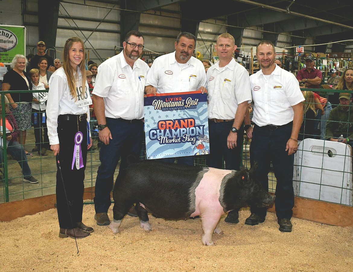 Jaci Pheifer sold her grand champion hog to Flathead Valley Les Schwab at the Flathead Livestock Market Sale Auction at the Northwest Montana Fair. (Photo courtesy of Alicia Gower)