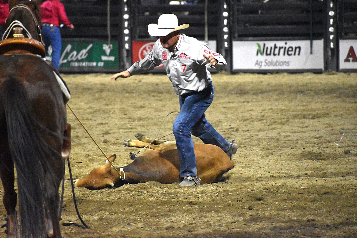 Tie-down roper Ryan Thibodeaux calls time on Saturday night at the Moses Lake Roundup.