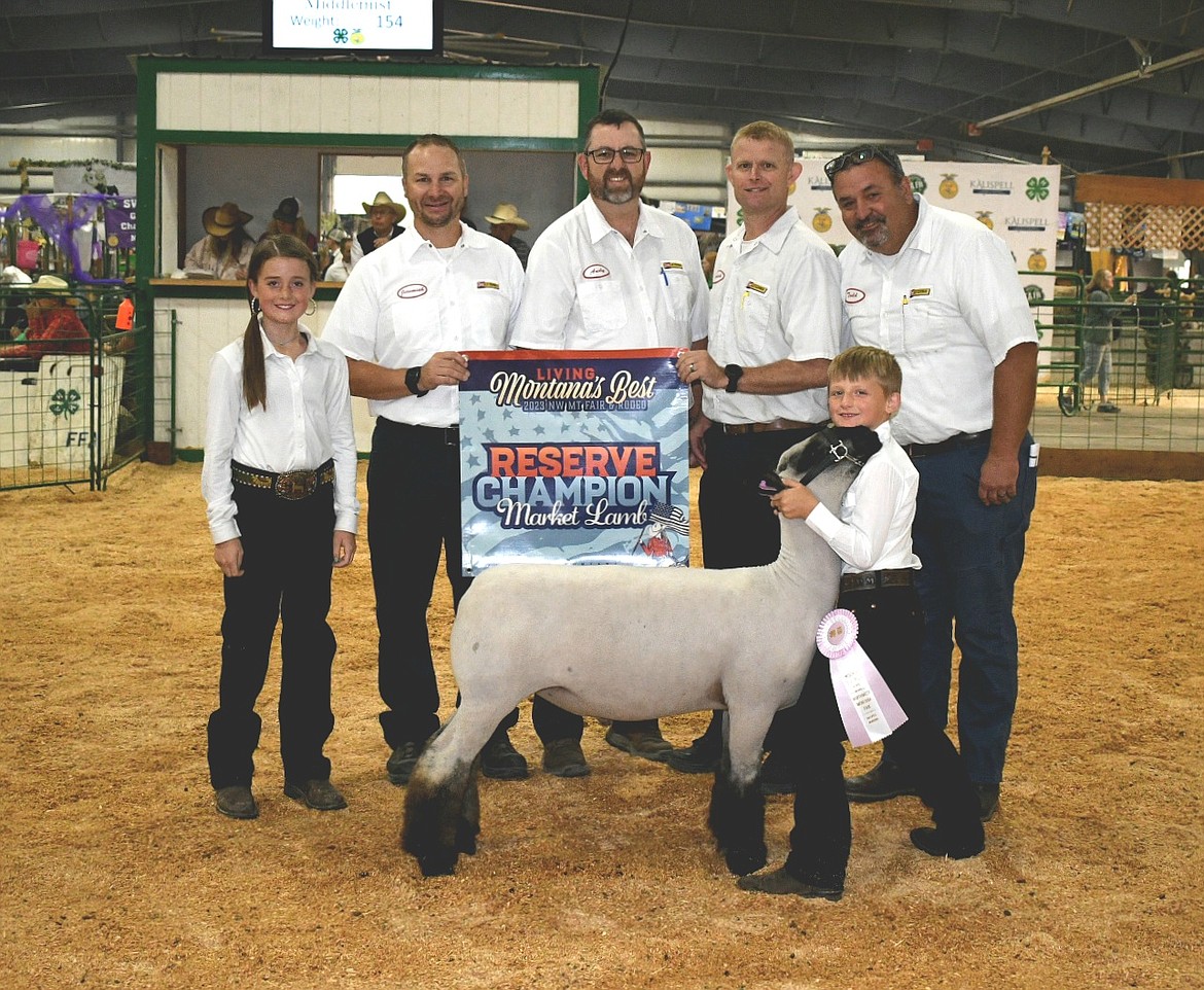 Ryder Middlemist sold his reserve champion lamb to Flathead Valley Les Schwab at the Flathead Livestock Market Sale Auction at the Northwest Montana Fair. (Photo courtesy of Alicia Gower)