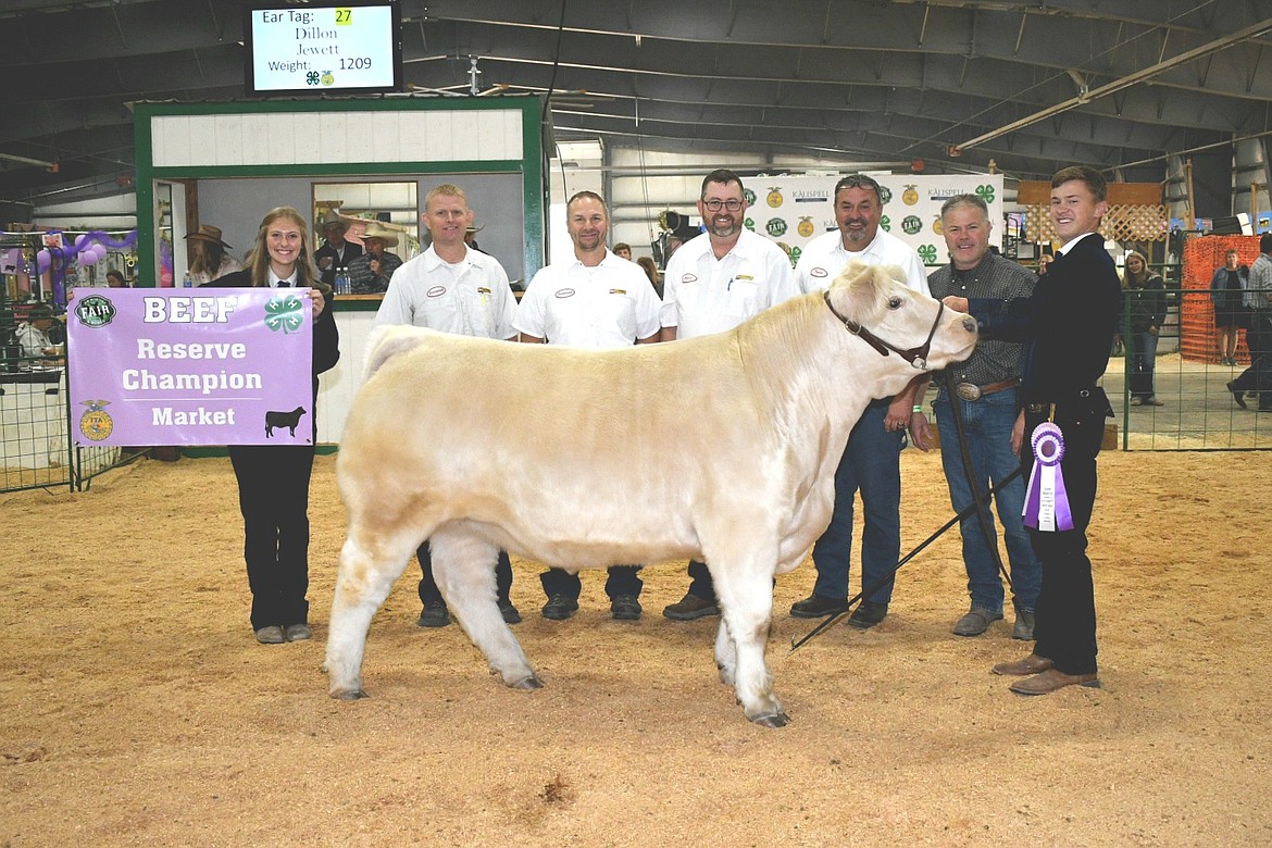 Dillon Jewett sold his reserve champion steer to Flathead Valley Les Schwab at the Flathead Livestock Market Sale Auction at the Northwest Montana Fair. (Photo courtesy of Alicia Gower)