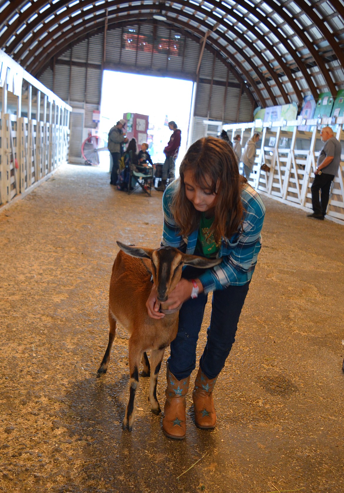 Piper Harrel, 10, of Rathdrum, gets her goat, Lady to practice show walking. Harrel is an enthusiastic member of the Pioneer Panhandle 4-H club.