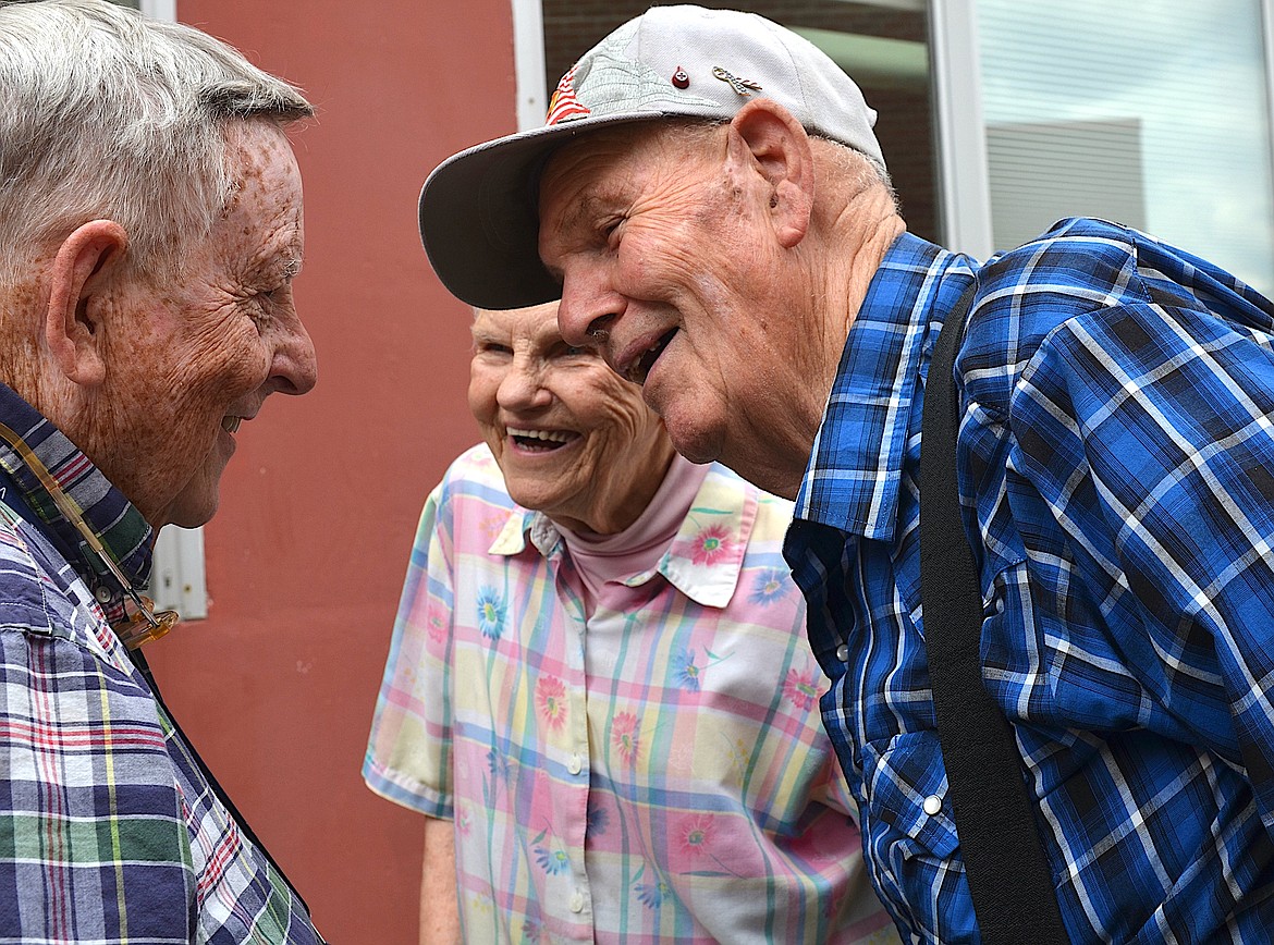 John Payne visits with Tike and Mary Parsons, who say they've known each other "forever." (Kristi Niemeyer/Leader)