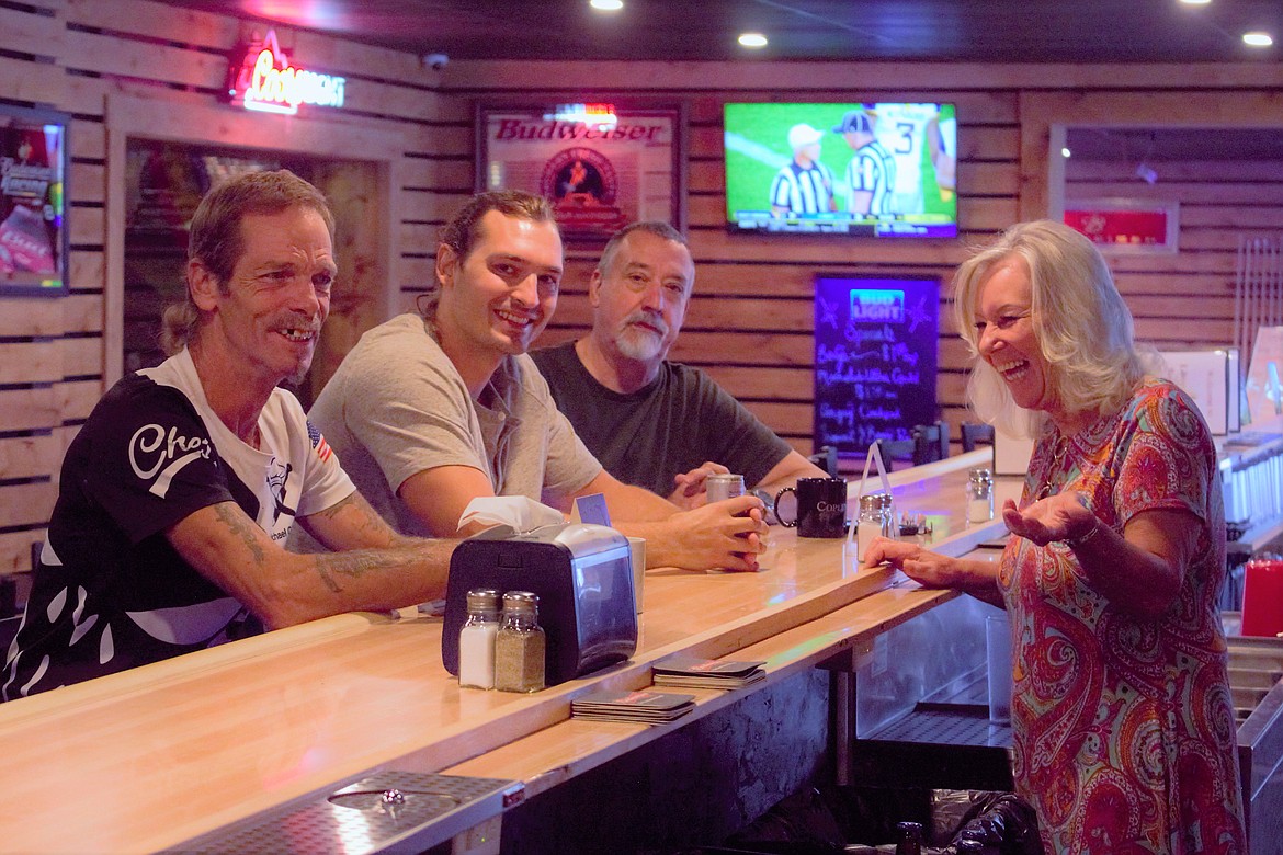 Liberty Lanes staff and owners show off the new sports bar.