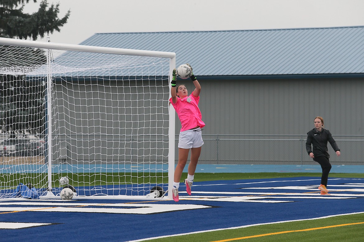 Incoming sophomore Macy Walters catches a soccer ball Tuesday as she and her teammates are some of the first to practice on the new Viking Field at Coeur d'Alene High School.