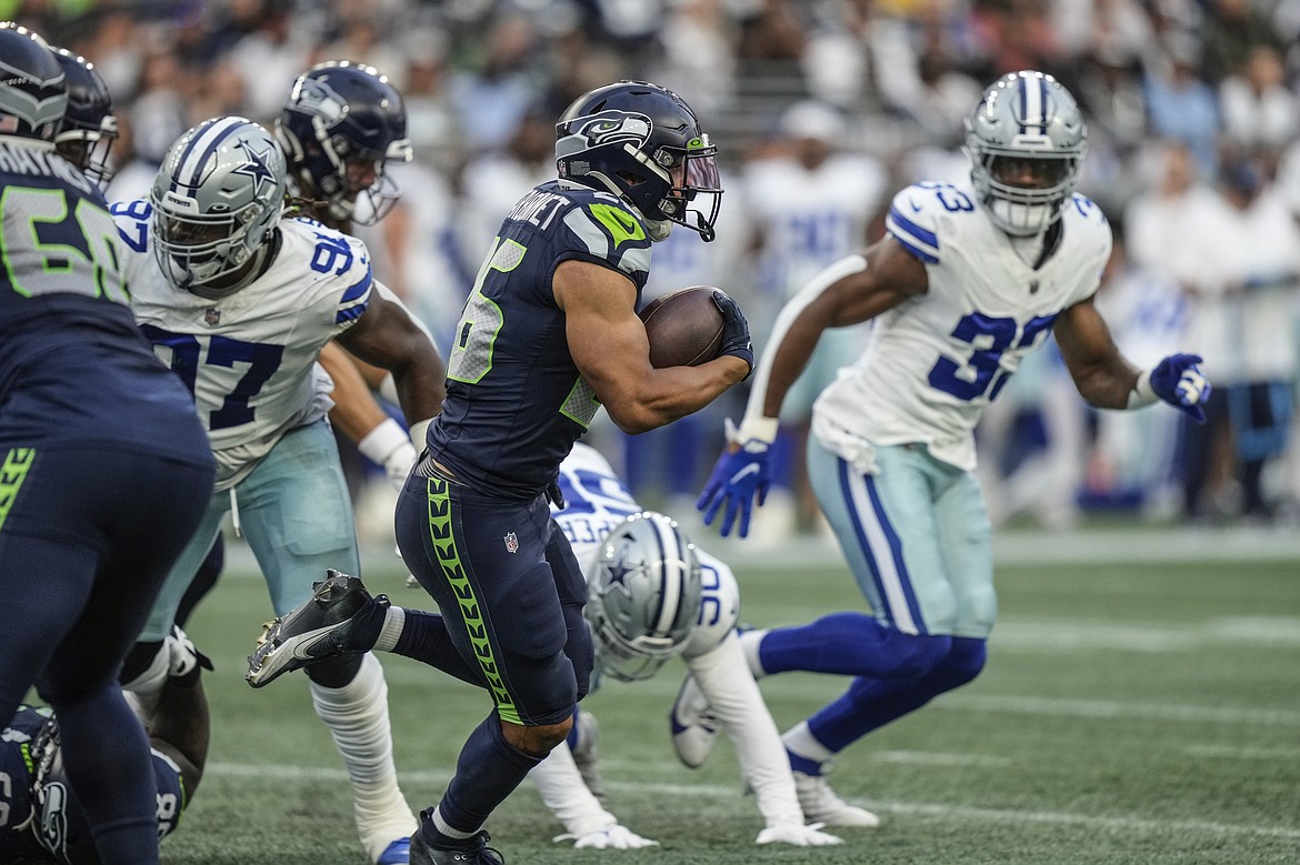 Seahawks rookie running back Zach Charbonnet carries the ball against the Dallas Cowboys during Seattle’s 22-14 preseason win on Saturday.