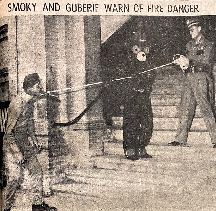Coeur d’Alene Police Chief Arnold Eugene and Smokey Bear apprehend the cigar-chomping Guberif during the 1958 fire season. Smokey and the Guberif were played by Jaycees Jim Cook and Leon LeBert, respectively.