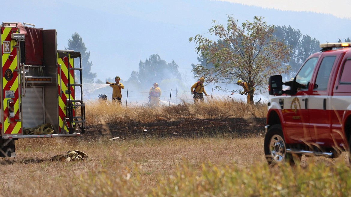 Spokane Valley firefighters responded to a brush fire in Otis Orchards on Wednesday. Swift reporting of the fire and containment led to evacuated families being able to return to their homes.