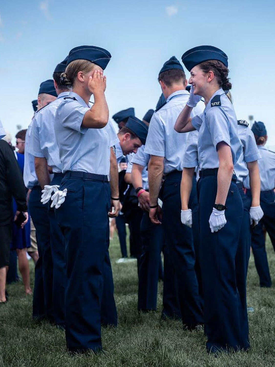 Hannah Hoatson, right, salutes her good friend Erika Gallus on Aug. 9 after Hoatson is accepted into the Air Force Academy in Colorado Springs. Both grew up in North Idaho and served as cadet commanders for the local Civil Air Patrol.
