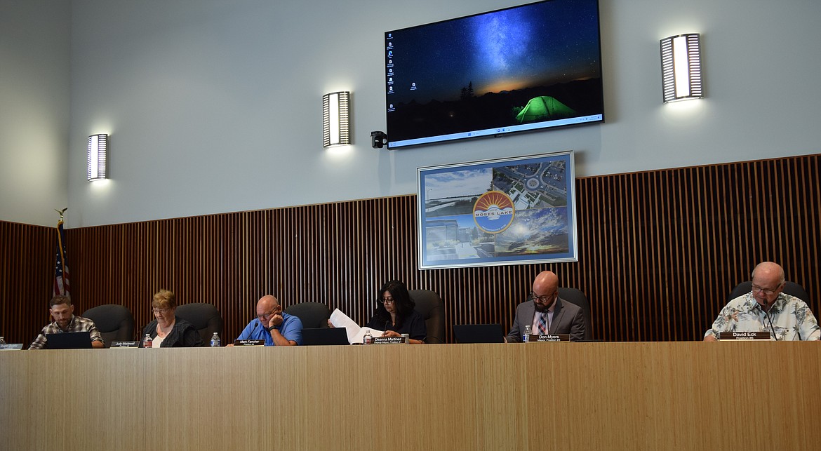 Moses Lake City Council members look over the agenda during Tuesday’s regular city council meeting, which saw the unanimous approval of a graffiti regulations ordinance.