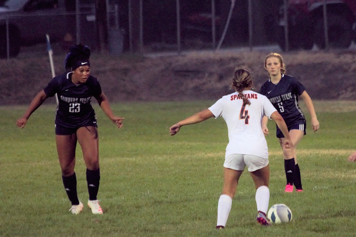 Priest River's Lizzie McCracken gets ready to make move on two Bonners Ferry defenders during the second half of Tuesday's season-opener. McCracken scored the Spartans only goal during the 37th minute of the match.