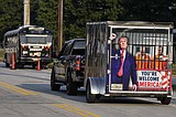 Scores of Trump fans gather outside Georgia jail to show support ahead of his expected surrender
