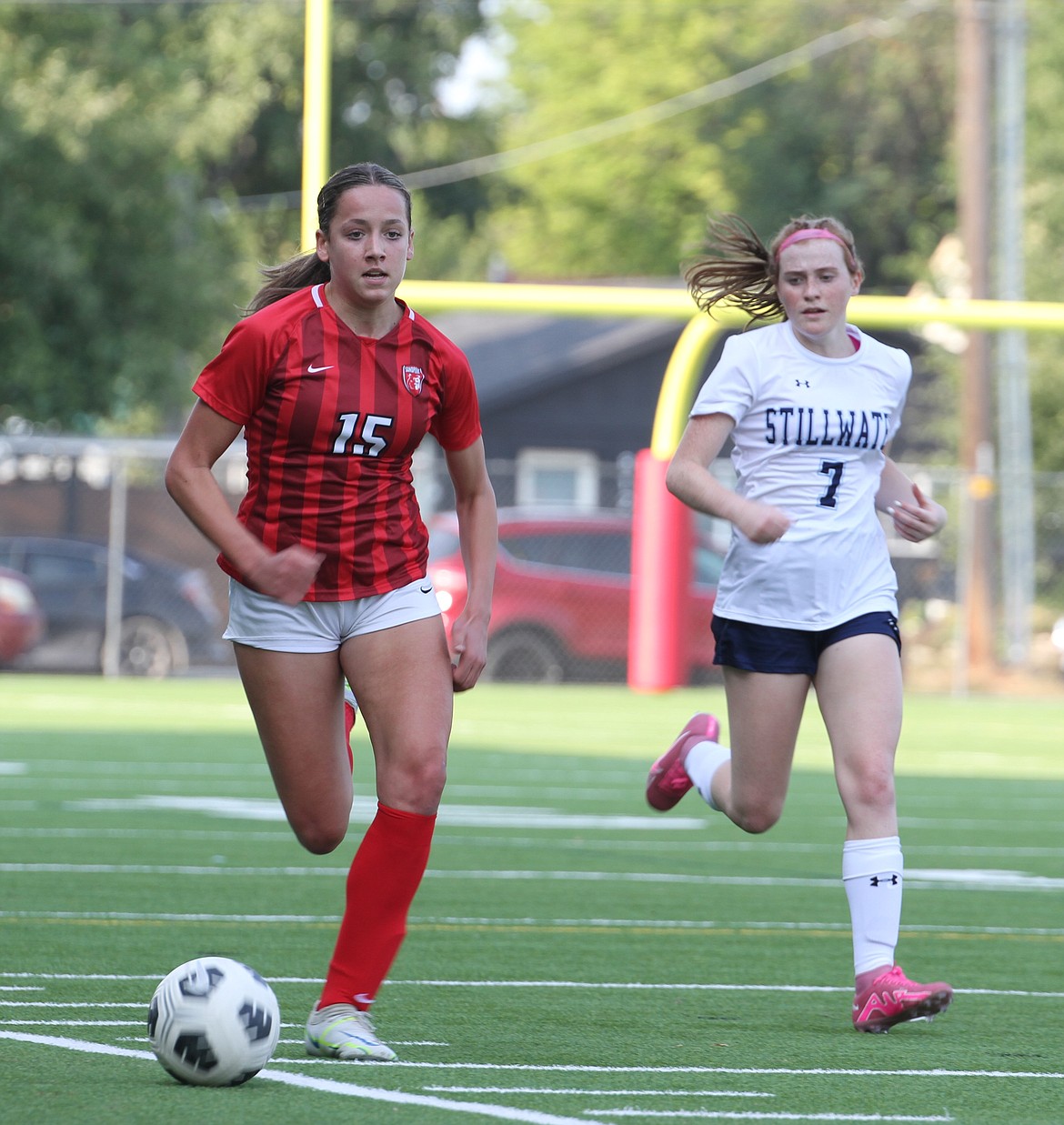 Sandpoint sophomore Reese Burnett dribbles down the sideline and past a Stillwater Christian defender in Thursday's 14-0 victory.