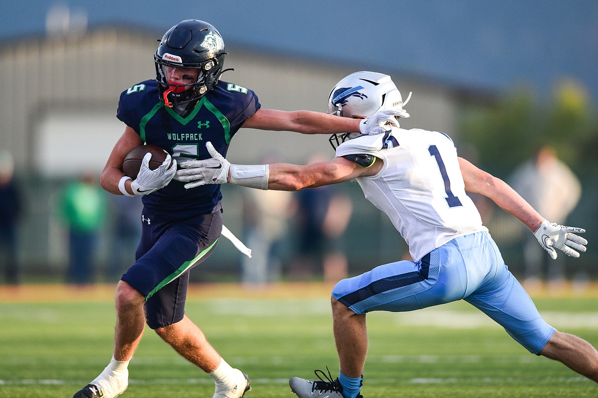 Glacier wide receiver Bridger Smith (5) looks to get past Great Falls defender Jace Kirkhart (1) in the first half at Legends Stadium on Friday, Aug. 25. (Casey Kreider/Daily Inter Lake)