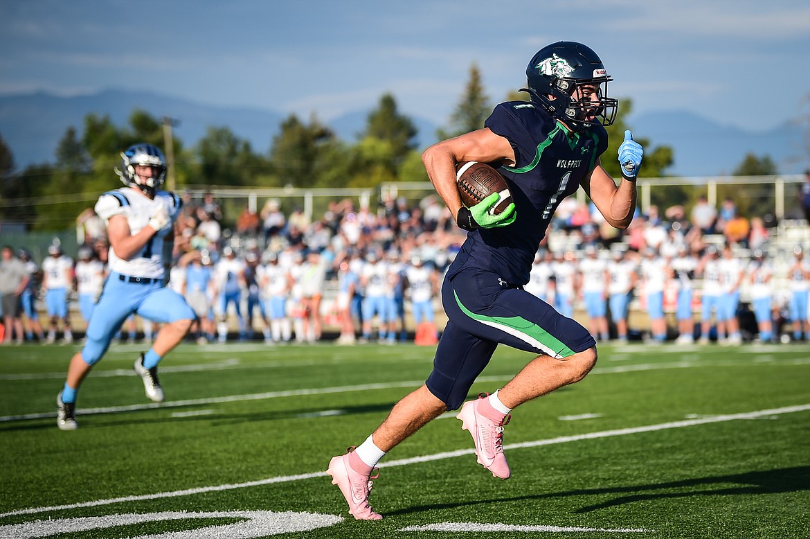 Glacier wide receiver Cohen Kastelitz (1) heads to the end zone on a 70-yard touchdown reception on a flea flicker on the first play of the game against Great Falls at Legends Stadium on Friday, Aug. 25. (Casey Kreider/Daily Inter Lake)