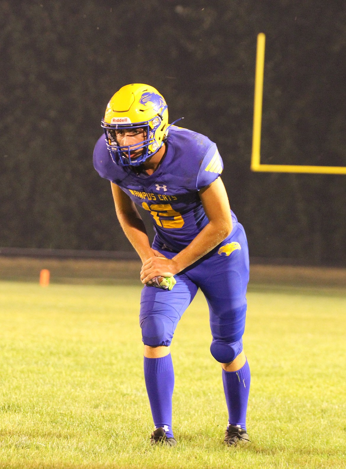 Wide receiver Evrett Montgomery toes the line of scrimmage and gets ready to run a route in a game earlier this season. The junior has produced on both the offensive and defensive sides of the ball this year.