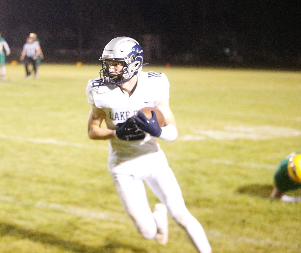 JASON ELLIOTT/Press
Lake City junior wide receiver Jacob Hill breaks upfield en route to a 46-yard touchdown reception in the fourth quarter of Friday's game against Lakeland.