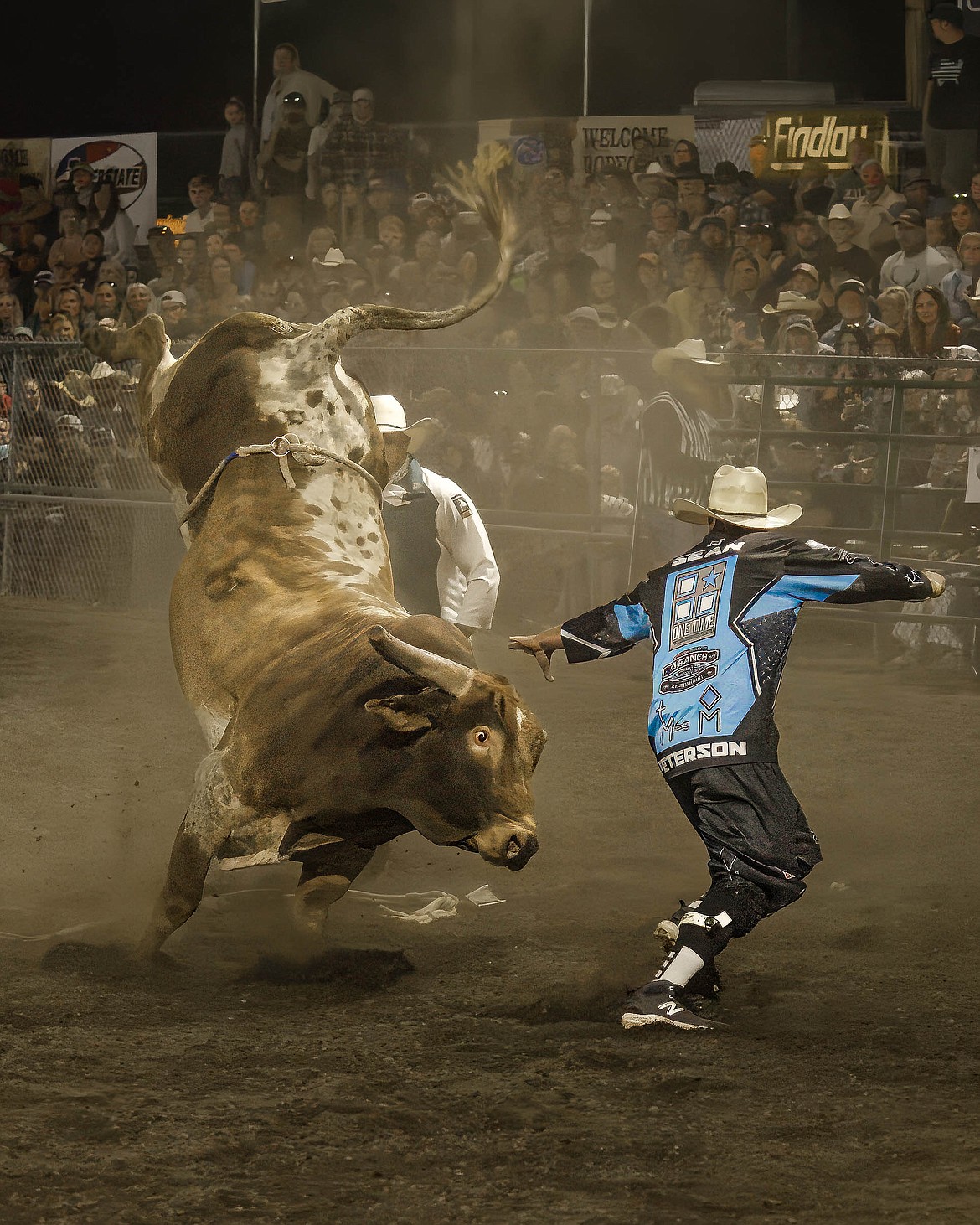 A bull kicks up its hooves Thursday during the Xtreme Bulls during the Gem State Stampede at the North Idaho State Fair.