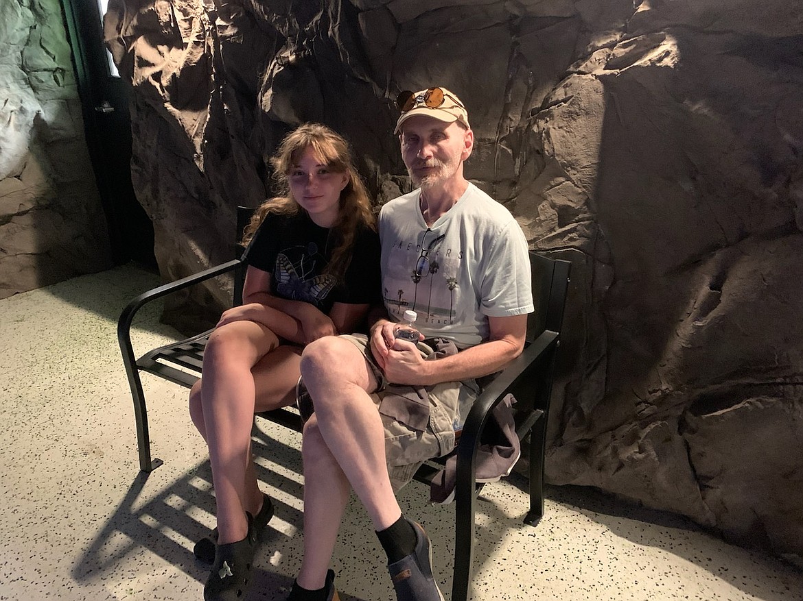 Aylis Manley, 11, and her dad, Dennis Manley, of Post Falls, are seen at Snake Discovery in Minnesota earlier this month.