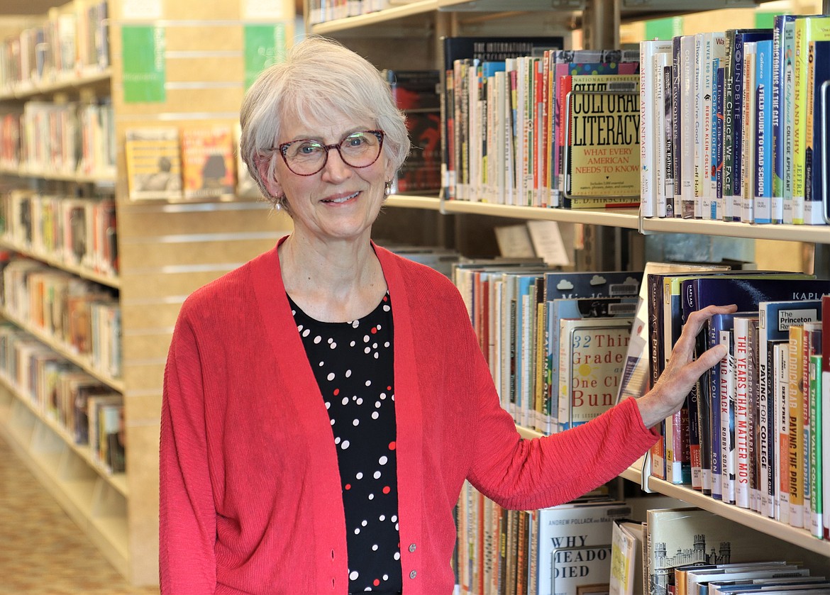 Fay Sweney poses in the Coeur d'Alene Public Library. She is leaving the library's board of trustees after 42 years.