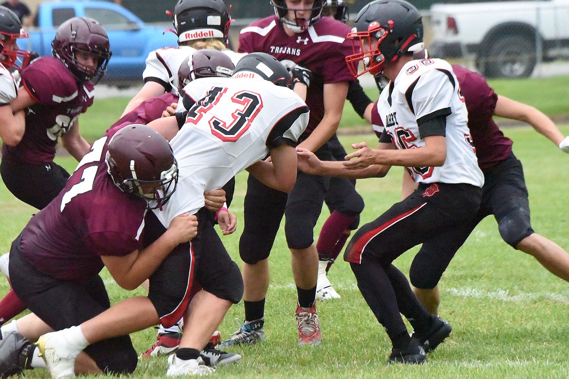 Troy defensive lineman Derek Cole brings down a runner in Friday's game against Darby. (Scott Shindledecker/The Western News)