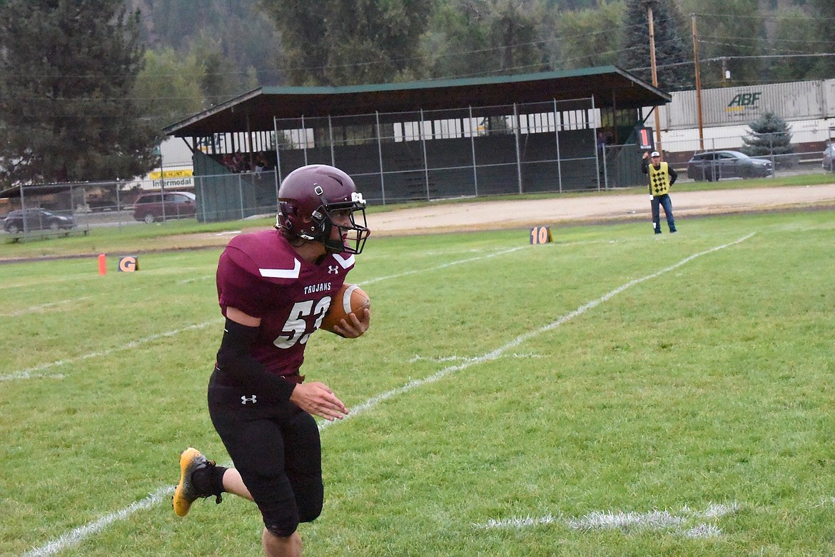 Troy's Liam Pallister returns a kick in Friday's game against Darby. (Scott Shindledecker/The Western News)