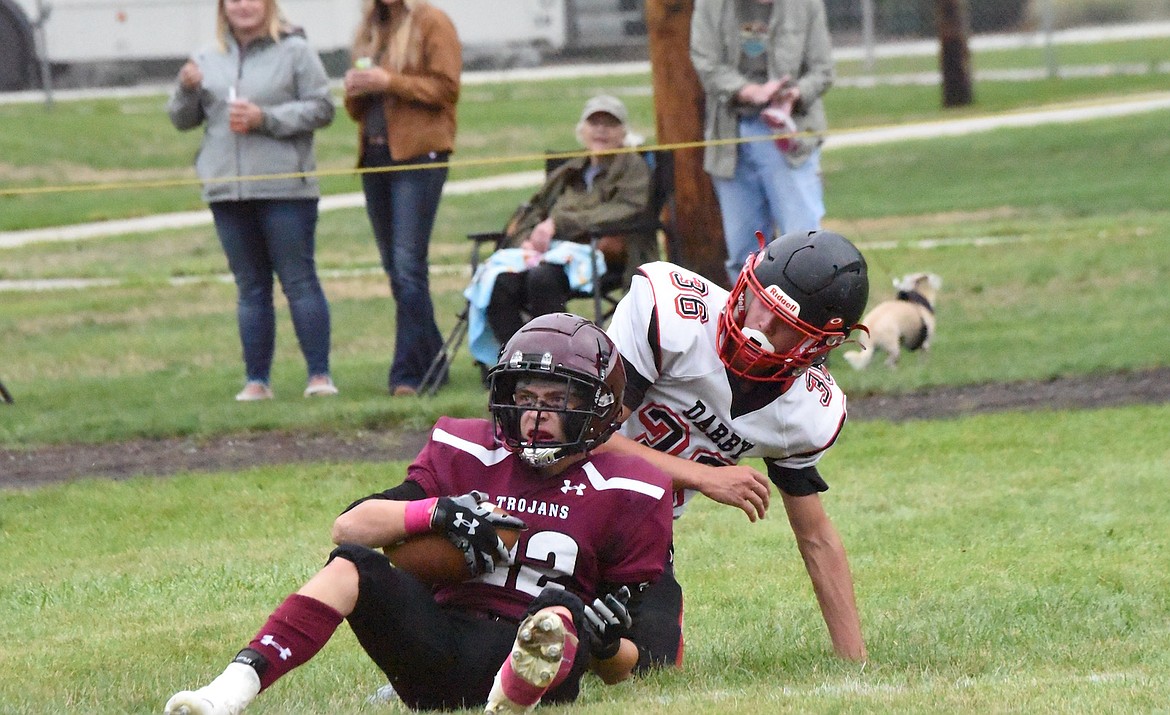 Troy's Mason Crowe catches a touchdown pass in Friday's game against Darby. (Scott Shindledecker/The Western News)