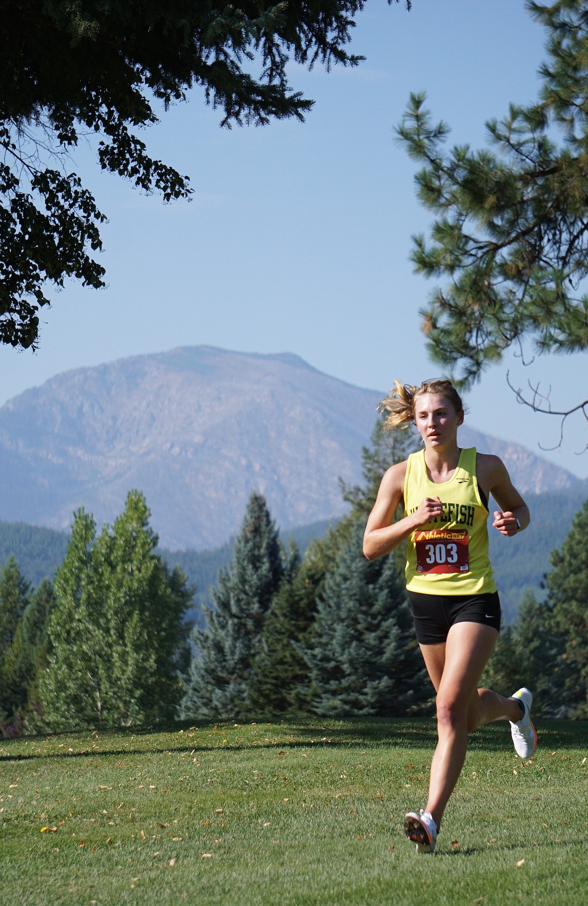 Whitefish Senior Maeve Ingelfinger places fourth overall in the women’s varsity race with a time of 20:30.82 in Libby on Friday. (Matt Weller photo)