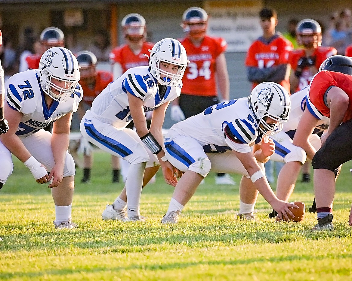 Bulldog Titan Mansell prepares to hike the ball in Friday's season opener against Plains. (Christa Umphrey photo)