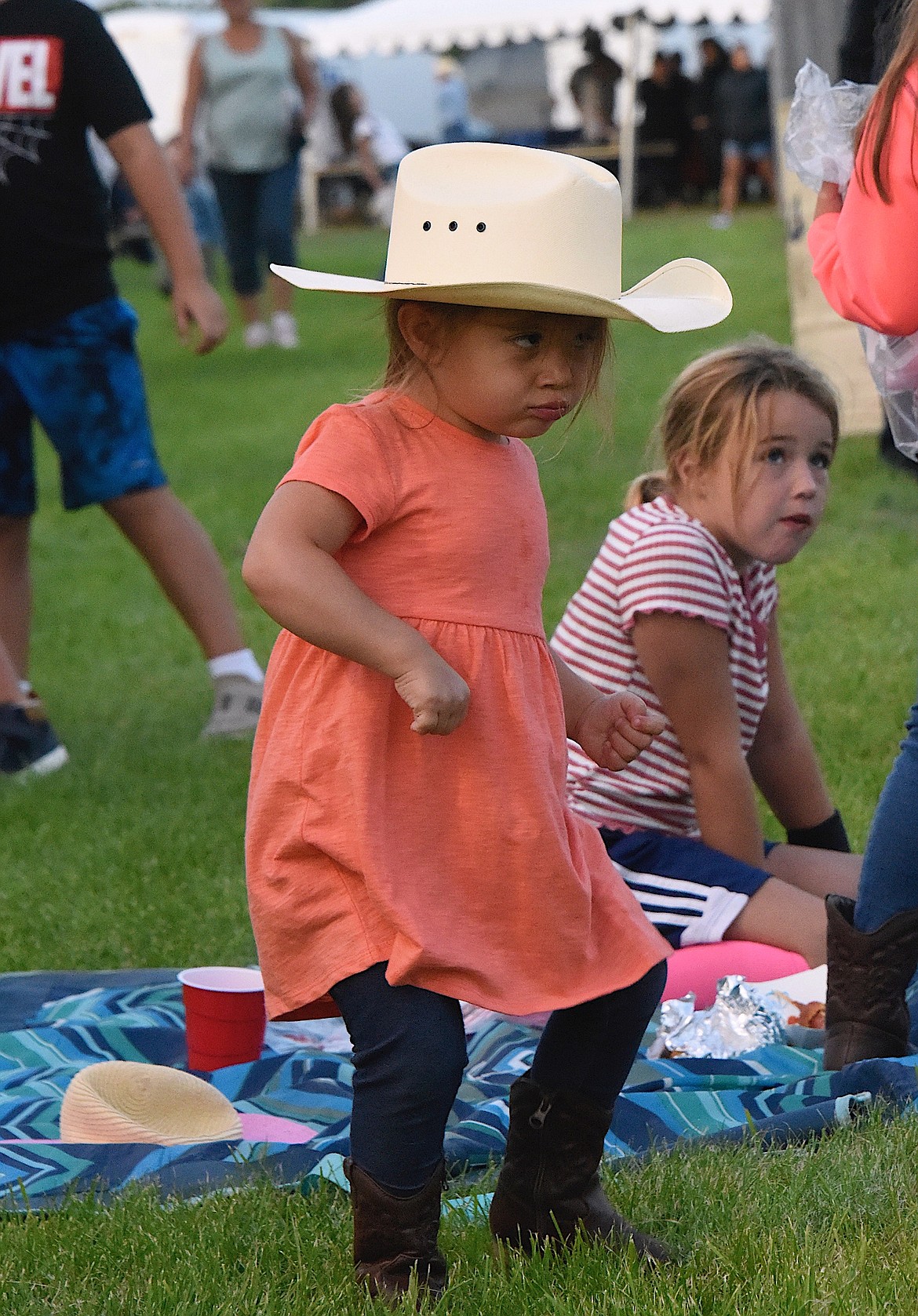 A young cowgirl dances to the music at the Flathead River Rodeo. (Berl Tiskus/Leader)