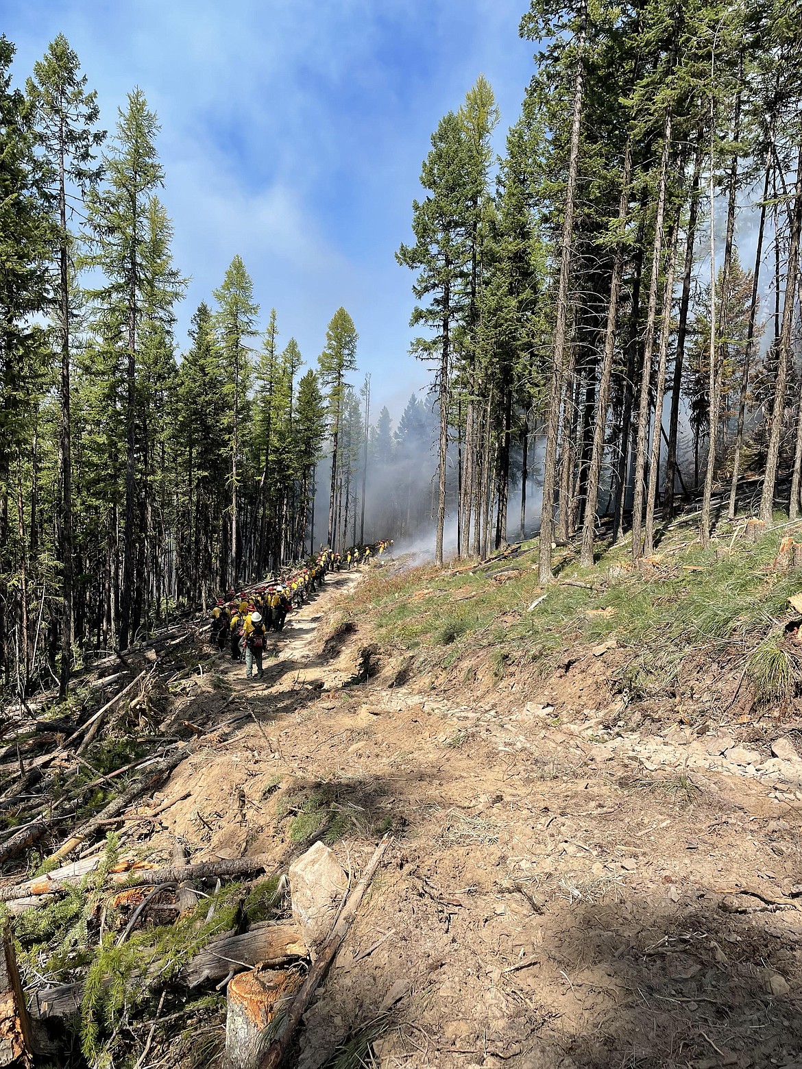 Firefighters patrol fireline during firing operation on the River Road East Fire on Sunday, August 27. (InciWeb photo)