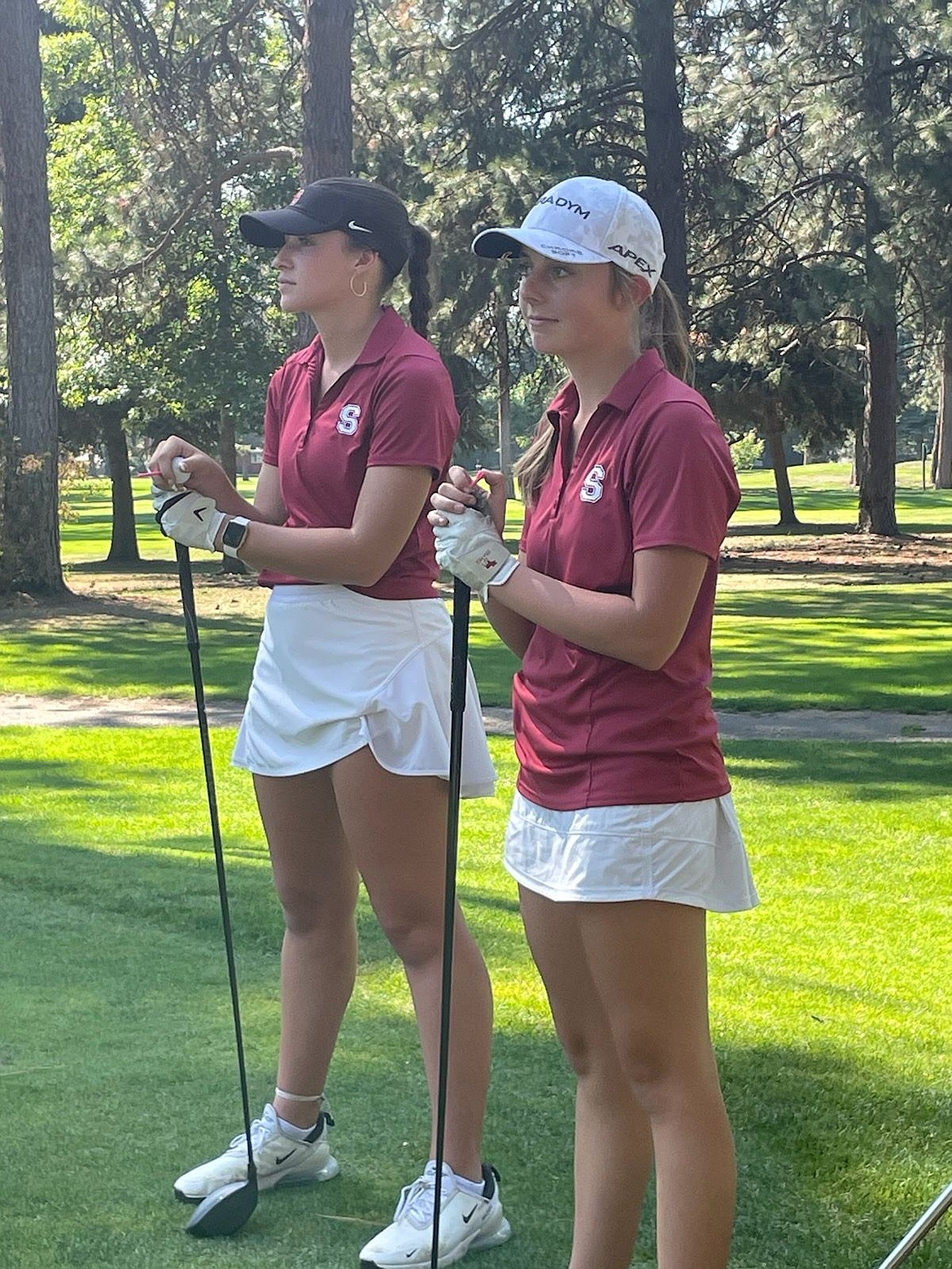 Alexa Tuinstra, left, and Taylor Mire, right, admire the greens of the Coeur d'Alene Golf Club.