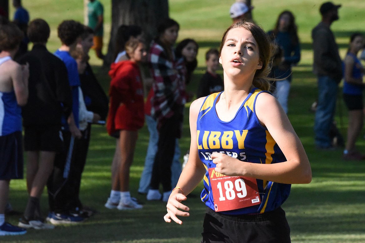 Libby High School cross country runner Carmen Kohler comes to the finish line at the Libby Invitational on Aug. 25. (Scott Shindledecker/The Western News)